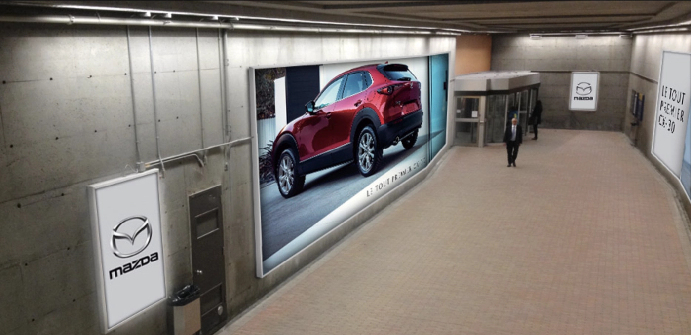 SEG fabric lightbox with TLS lighting technology displaying a Mazda advertising campaign in the underground corridor at 1000 De La Gauchetière.