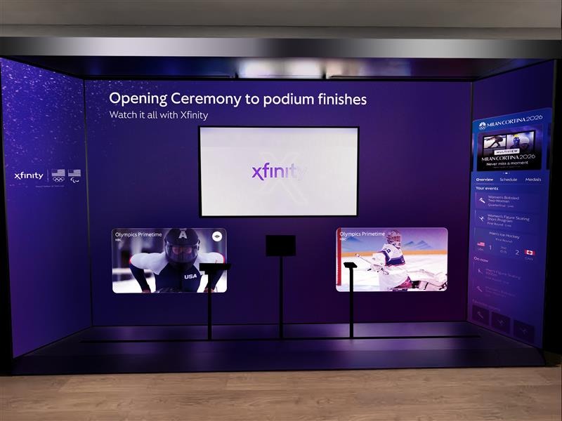 Immersive Xfinity Olympic experience display featuring large LED video walls showing winter sports content and interactive screens